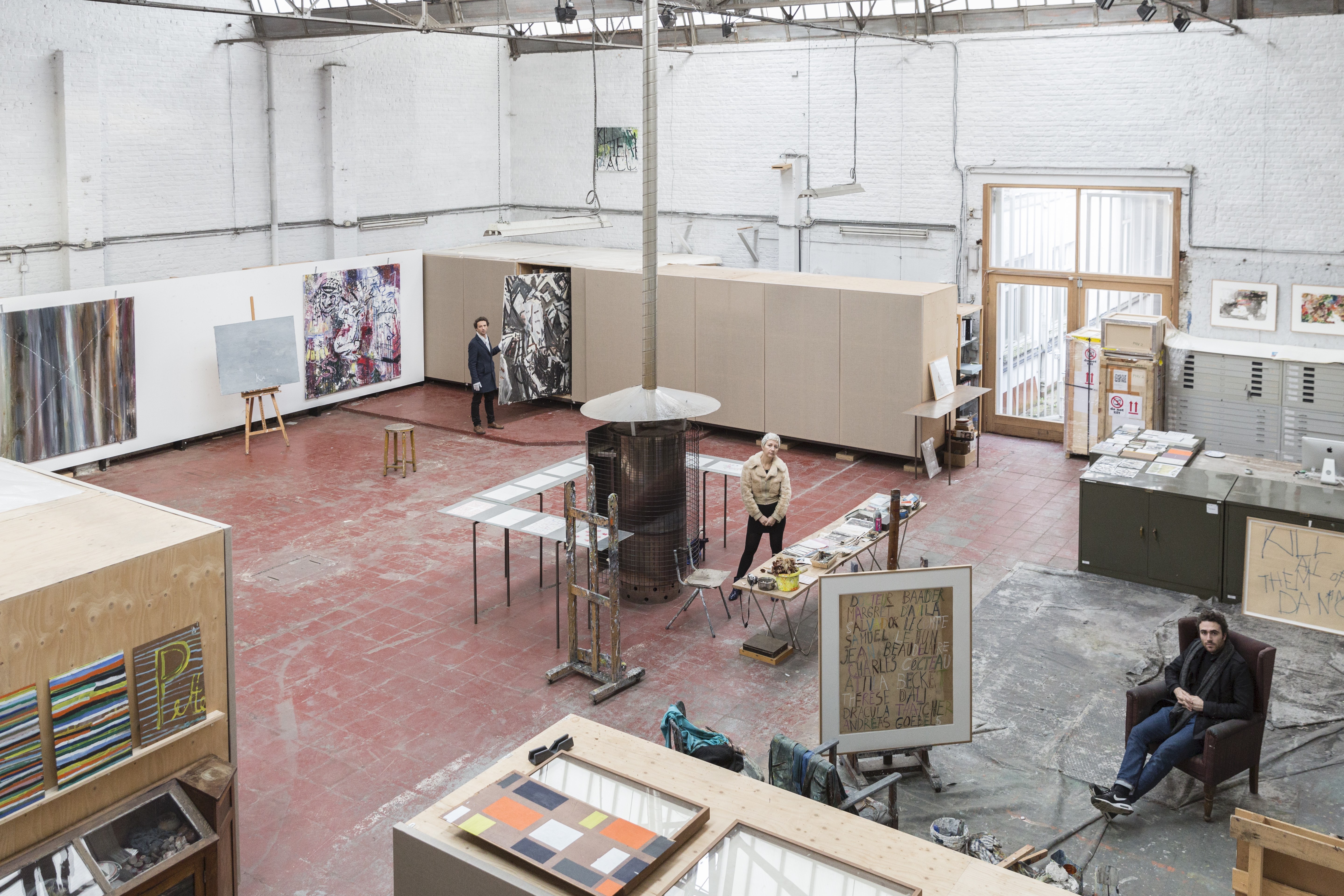 Guillaume, Hélène and Mo Vandenberghe (left to right) in the Molenbeek studio of their father Philippe Vandenberg. © Joke Floreal